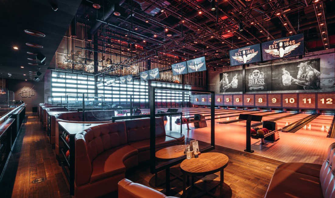 Brunswick distributor AKI Fitness - The Brass Monkey bowling alley lanes and lounge area in Dubai