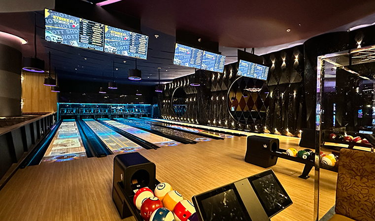 Shott Amusement Pune Small boutique bowling center with spark immersive bowling and bowling balls on ball return